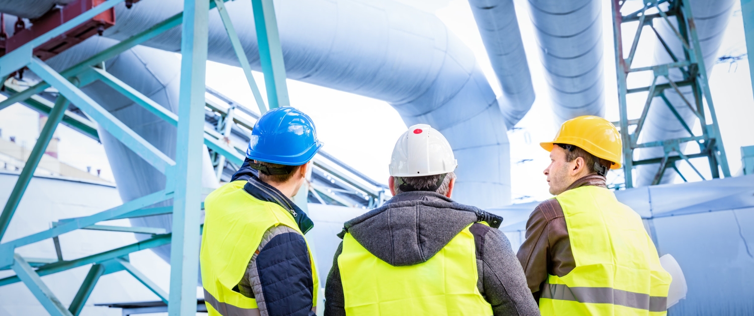 Engineers discussing maintenance of a petrochemical plant